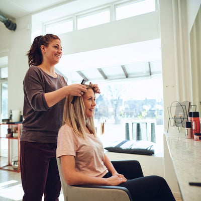 Dana R. at work in her salon